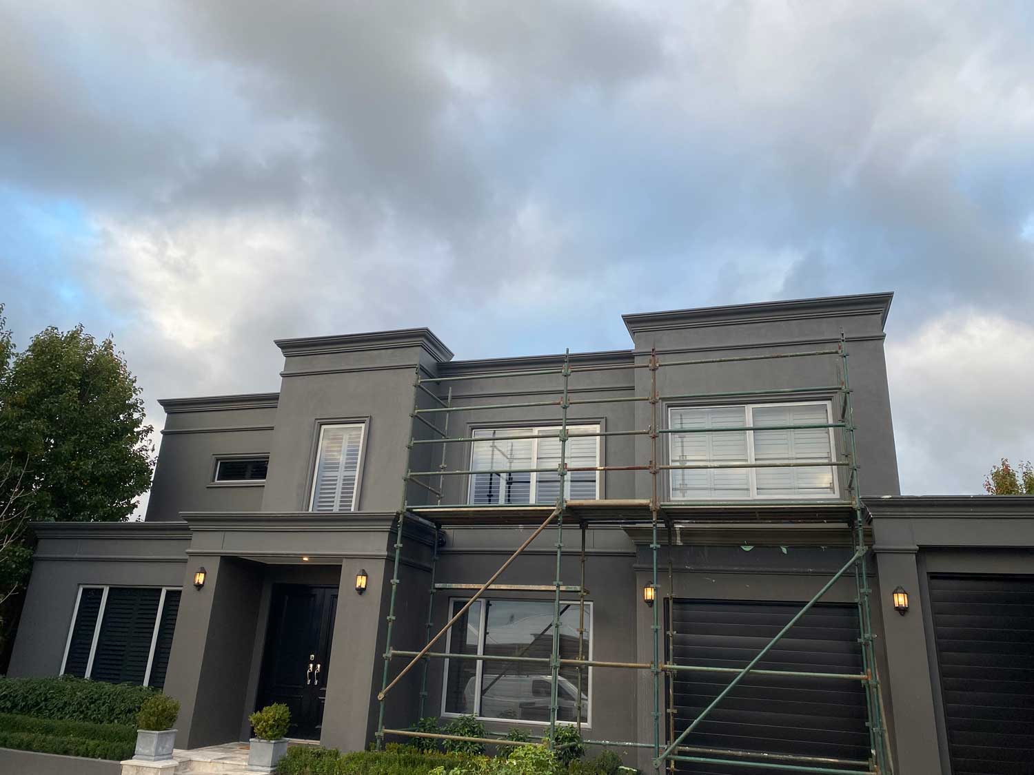 Splendeid New painted house, black wall and fencing.